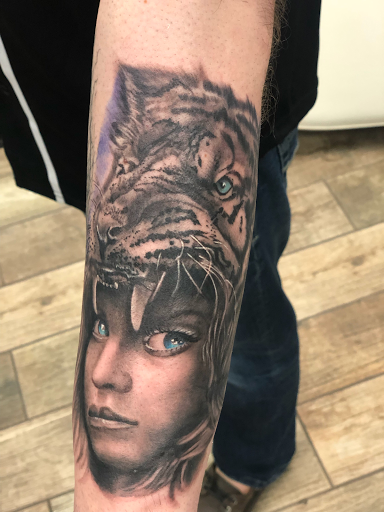 Explore beach tattoo ideas for guys, creative tattoo ideas in Buford, available at Wild Tribe Tattoos and Piercings