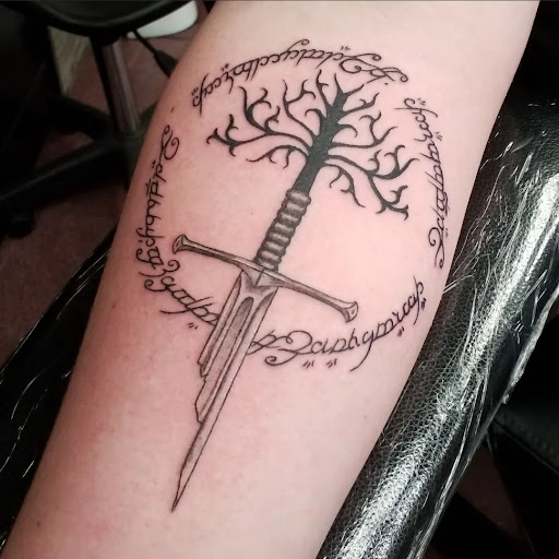 Explore bourbon glass tattoo idea, creative tattoo ideas in Longview, available at Fugis Tattoo Shop