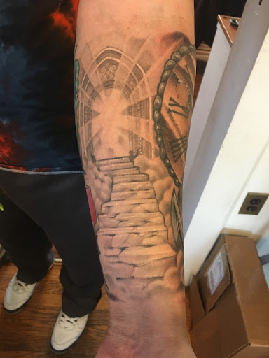 Explore 2 dog tattoo ideas, creative tattoo ideas in Milford, available at Golden Hammer Tattoo Studios