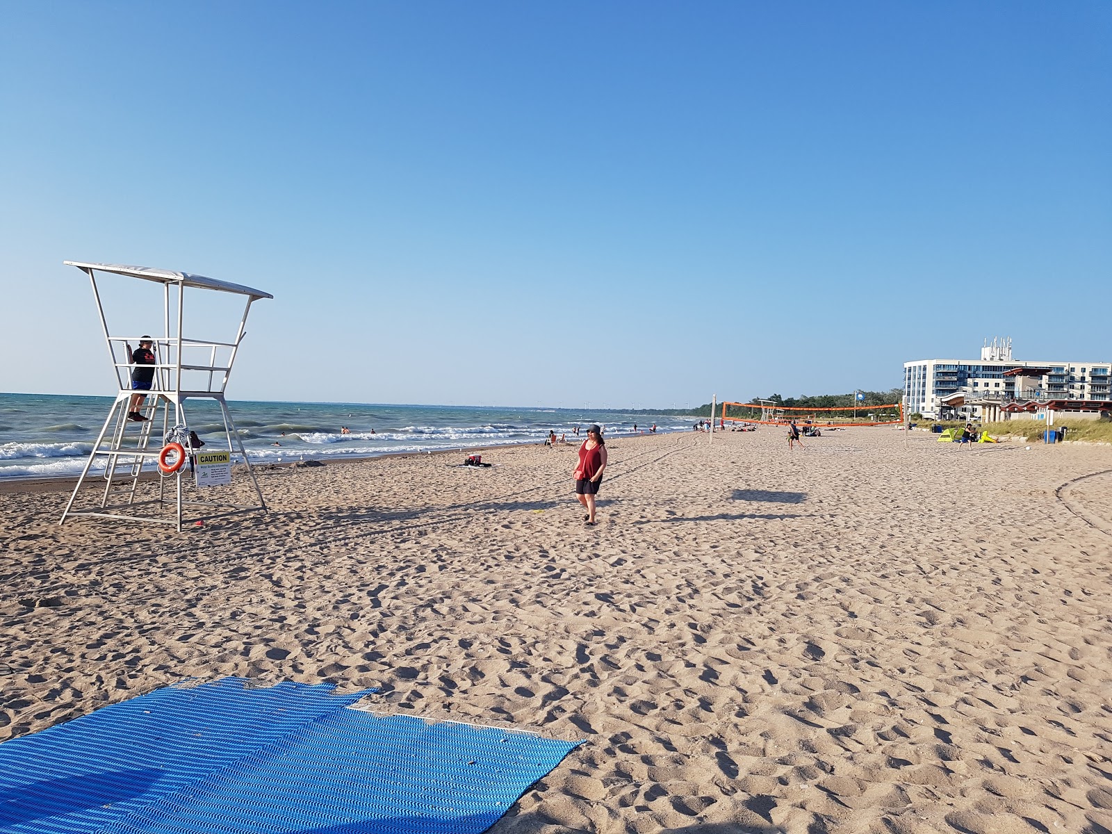 Fotografie cu Grand Bend Beach cu o suprafață de nisip strălucitor