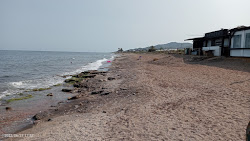 Photo de Playa la Entrevista avec rivage droit, long