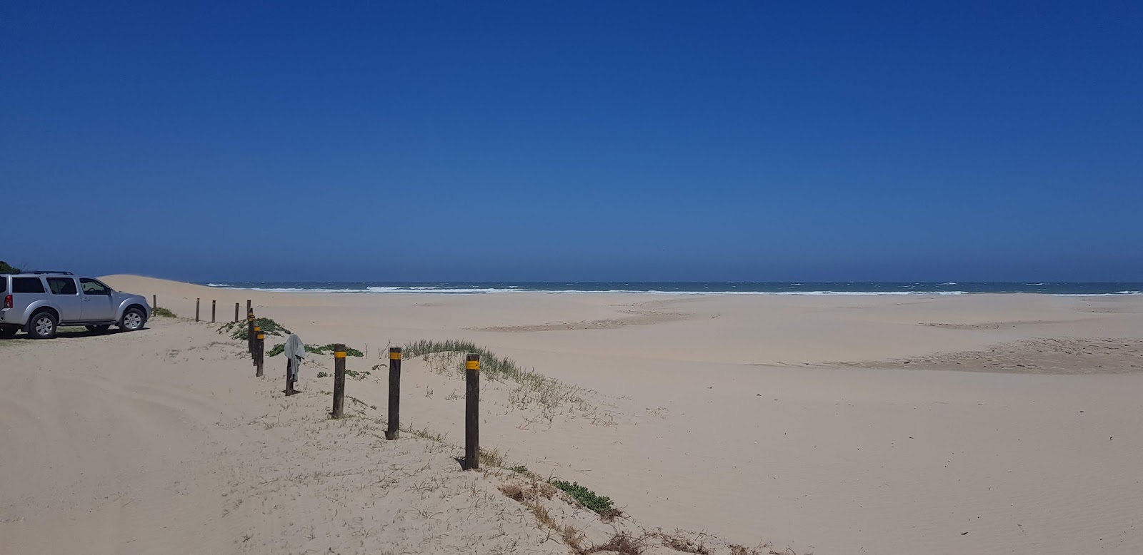 Foto van Begha Mouth beach gelegen in een natuurlijk gebied