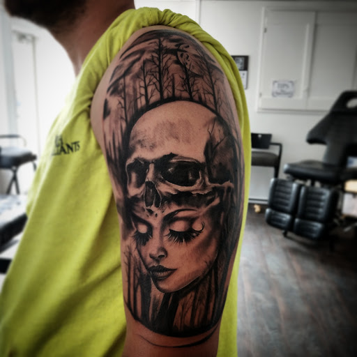 Explore invictus tattoo ideas, creative tattoo ideas in Medina, available at Greasers Ink