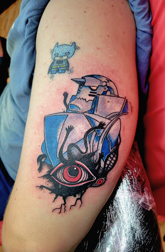 Explore sub tattoo ideas, creative tattoo ideas in Benton, available at Spectrum Tattoo