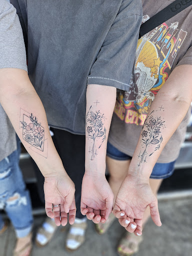 Explore son and daughter tattoo ideas for dad, creative tattoo ideas in Clarkston, available at Rogue Tattoo