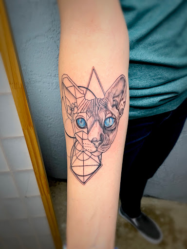 Explore tombstone movie tattoo ideas, creative tattoo ideas in Powell, available at Elysium Body Enhancements