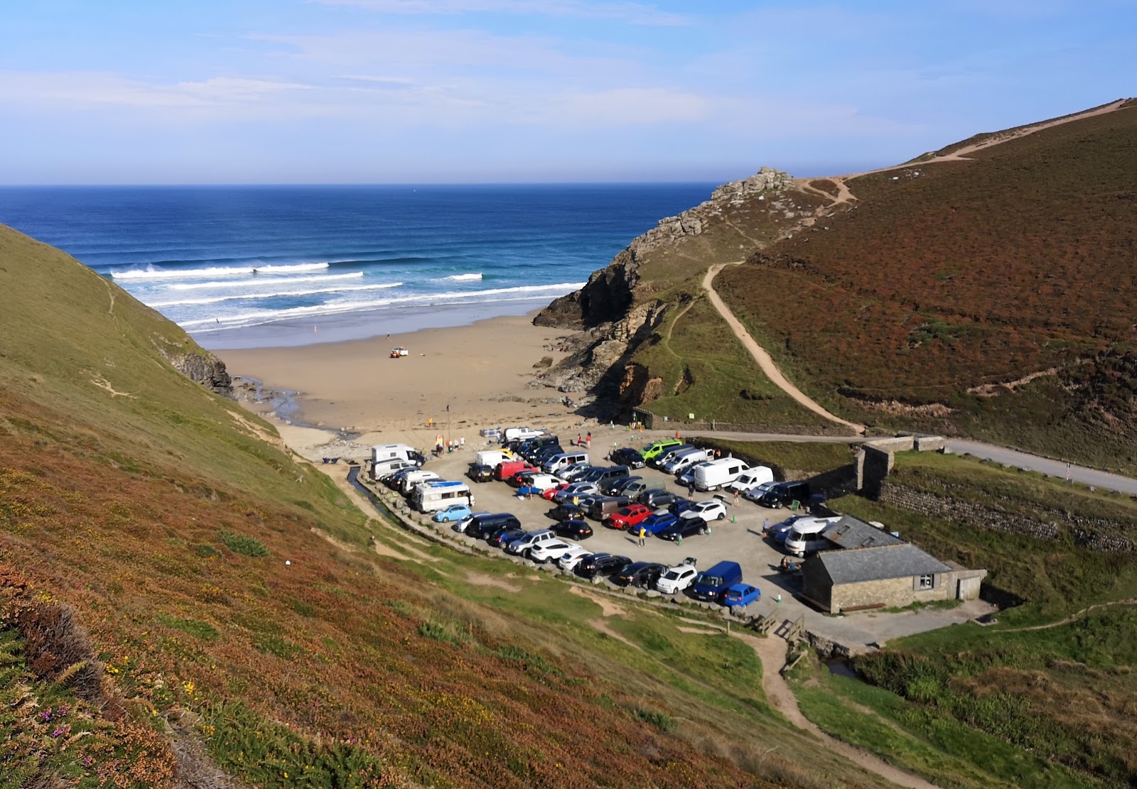 Photo of Chapel Porth beach with turquoise pure water surface