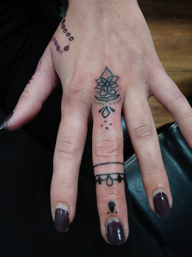 Explore hand mens tattoo ideas, creative tattoo ideas in Mastic, available at Crystal Blue Tattoo