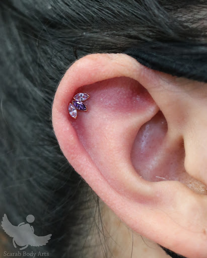 Explore ankle flower tattoo ideas, creative tattoo ideas in Syracuse, available at Scarab Body Arts