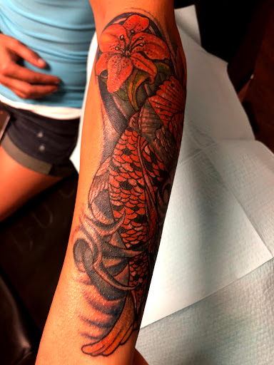 Explore skull tattoo sleeve ideas, creative tattoo ideas in Seymour, available at American Gypsy Tattoo Corp.