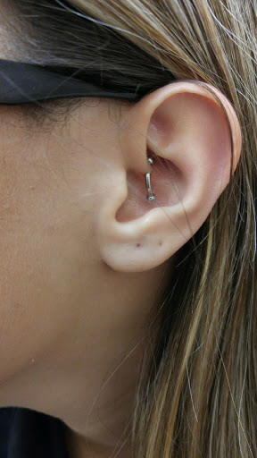 Explore neck tattoo ideas for woman, creative tattoo ideas in Boca Raton, available at The Piercing Doctor