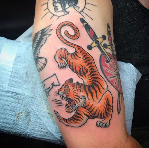 Find camping tattoo ideas for your next unique tattoo in Libertyville at Lucky Seven Tattoo