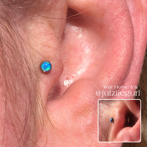 Explore tattoo ideas for women's lower back, creative tattoo ideas in Kent, available at War Horse Ink