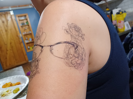 Explore female chest piece tattoo ideas, creative tattoo ideas in Olympia, available at Sorry Mom Ink Tattoos & Piercings Olympia