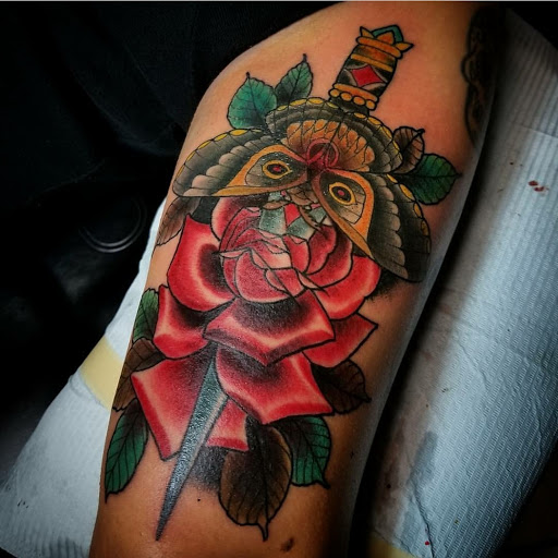 Explore street sign tattoo ideas, creative tattoo ideas in San Antonio, available at Dandyland Custom Tattoo and Professional Body Piercing