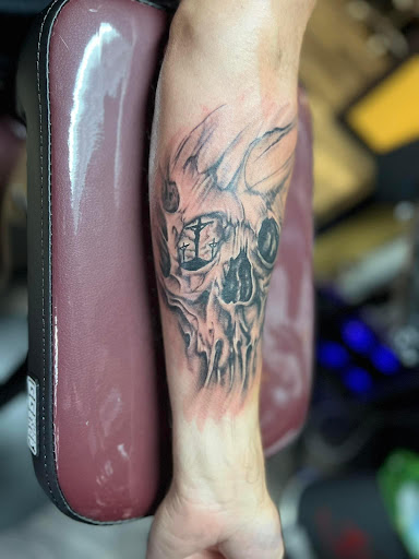 Explore reading tattoo ideas, creative tattoo ideas in Warner Robins, available at Untold Pain Tattoo Studio