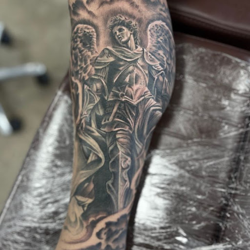 Explore rose tattoo ideas for men, creative tattoo ideas in Maryland Heights, available at Thirteen Roses Tattoo & Aesthetics
