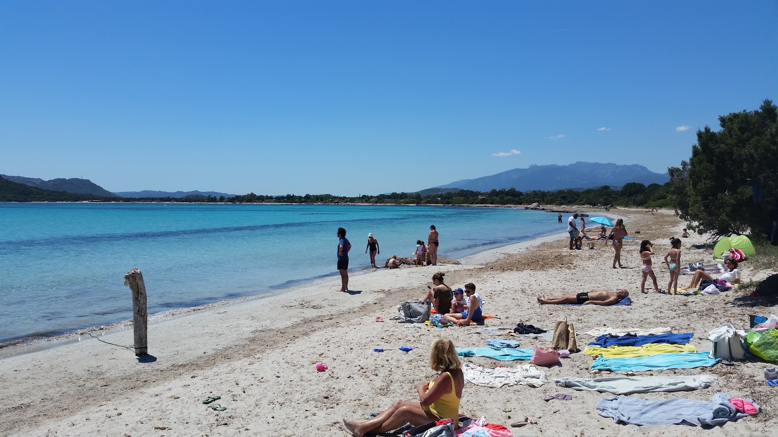 Photo of Plage de Pinarellu II with turquoise pure water surface
