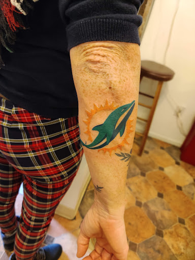 Explore highland cow tattoo ideas, creative tattoo ideas in Hebron, available at Explosive Ink Tattoo