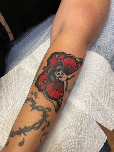 Find tattoo ideas for under the breast for your next unique tattoo in Glenside at Yellow Rose Tattoo