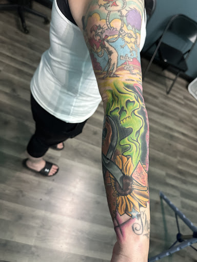 Explore sticker sleeve tattoo ideas, creative tattoo ideas in East Grand Forks, available at Fife Life Tattoo