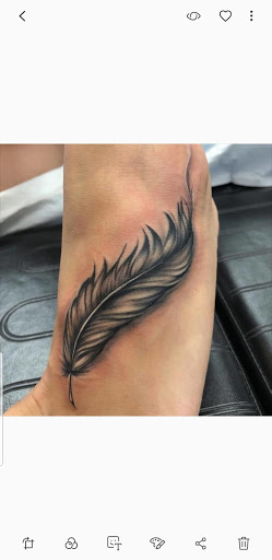 Explore dragon back tattoo ideas, creative tattoo ideas in Jamaica, available at Rising Phoenix Ink