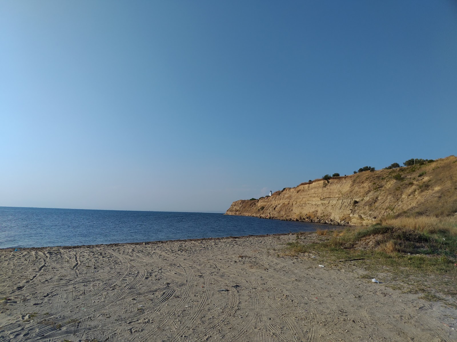 Foto van Caldera beach met zand met kiezelstenen oppervlakte