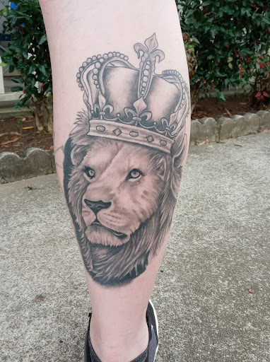 Explore red ink tattoo ideas, creative tattoo ideas in Calhoun, available at Velvet Panther Tattoo and Piercing