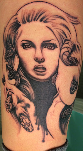 Explore mermaid tattoo ideas for females, creative tattoo ideas in Buffalo, available at Madd Ink Tattoo & Piercing