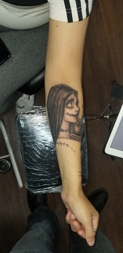 Explore under breast tattoo ideas for females, creative tattoo ideas in Lubbock, available at Sinners & Saints Art Company