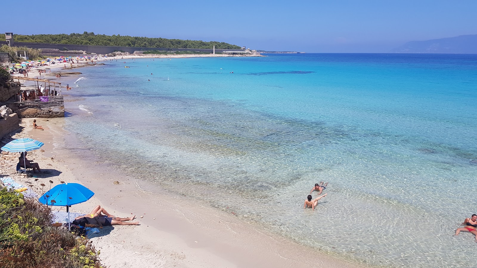 Photo of Cala Giovanna with turquoise pure water surface