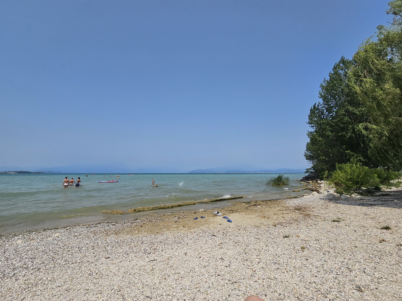 Foto von Spiaggia Punta Gro mit gras Oberfläche