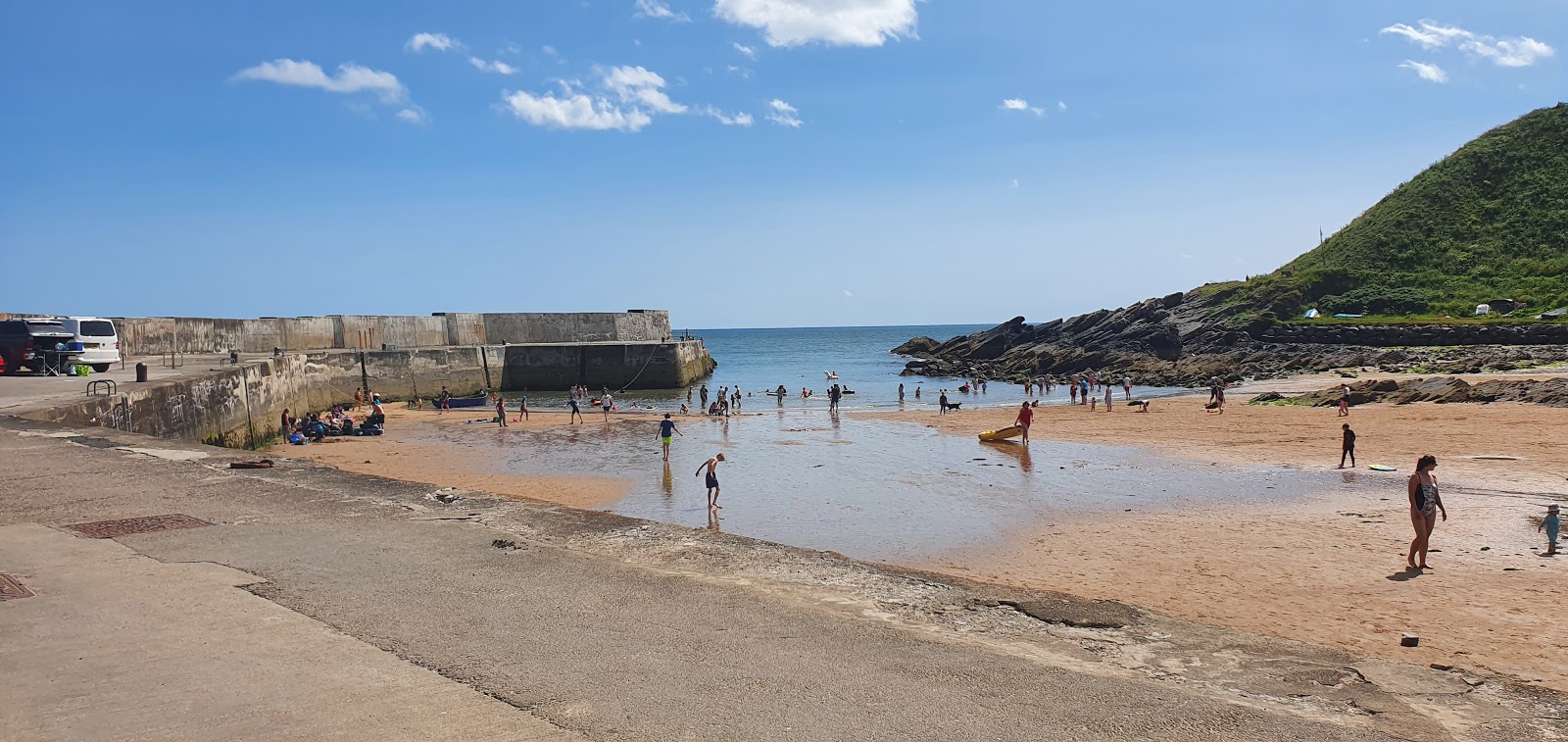 Photo of Collieston Beach with turquoise pure water surface
