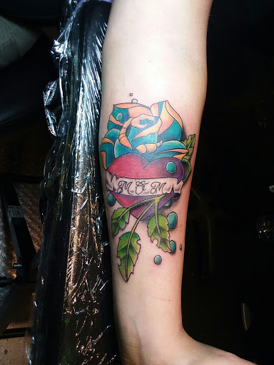 Explore aot tattoo ideas, creative tattoo ideas in Frankfort, available at Rhythm In Ink Tattoo Studio