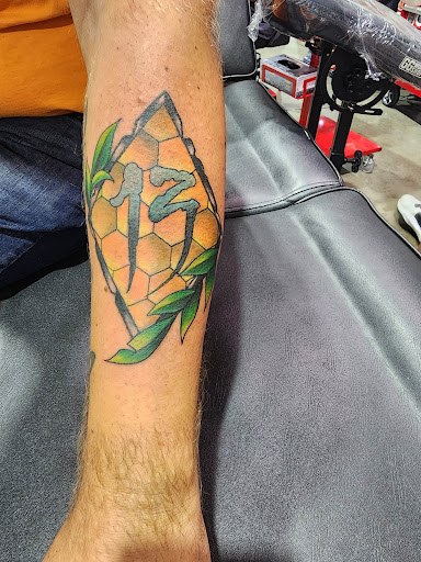 Explore pansy tattoo ideas, creative tattoo ideas in Wills Point, available at Tattanium Studios