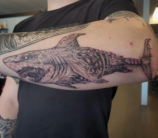 Explore wolf neck tattoo ideas, creative tattoo ideas in Palm Harbor, available at Angry Owl Tattoo and Piercing