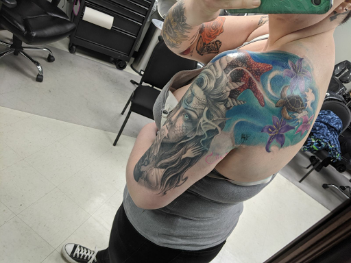 Explore nike tattoo ideas, creative tattoo ideas in New Brighton, available at HereAfter Tattoo Company