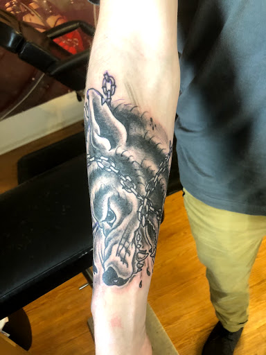 Explore dinosaur tattoo ideas for son, creative tattoo ideas in Madison, available at ART IMMORTAL TATTOO