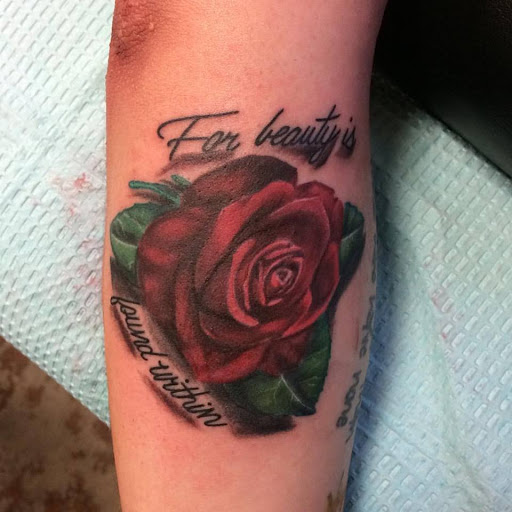 Explore scarface tattoo ideas, creative tattoo ideas in Chapel Hill, available at Golden Falcon Tattoo and Piercing