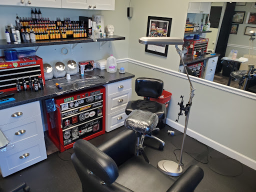 Explore tooled leather tattoo ideas, creative tattoo ideas in Englewood, available at Point of Entry Tattoo