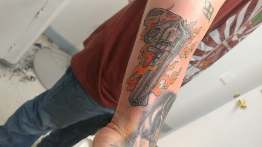 Explore dragon forearm tattoo ideas, creative tattoo ideas in Flint, available at Southern Outlaw Tattoo