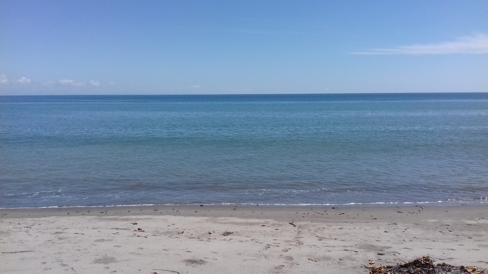 Las Mellizas Beach的照片 带有碧绿色纯水表面
