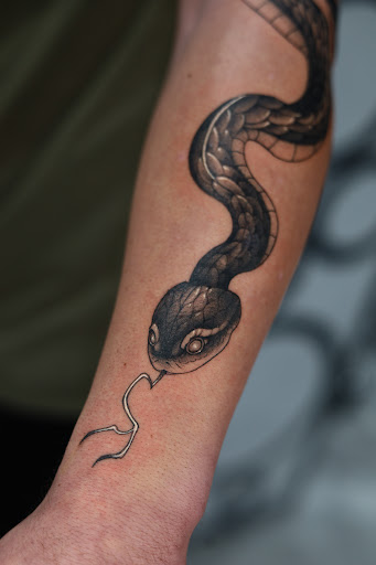 Explore strength tattoo ideas, creative tattoo ideas in Southfield, available at Enki Tattoo