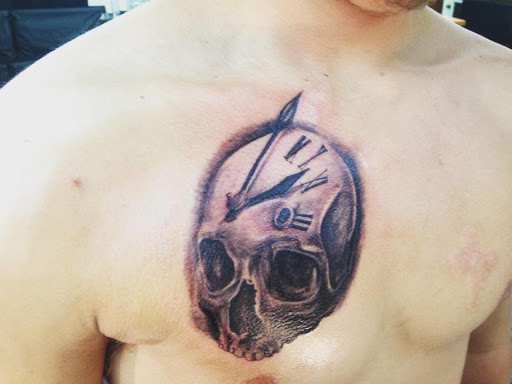Explore thigh tattoo ideas men, creative tattoo ideas in Powderly, available at Best Ink Tattoo Studio