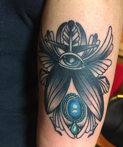 Explore wild tattoo ideas, creative tattoo ideas in Chapel Hill, available at Golden Falcon Tattoo and Piercing