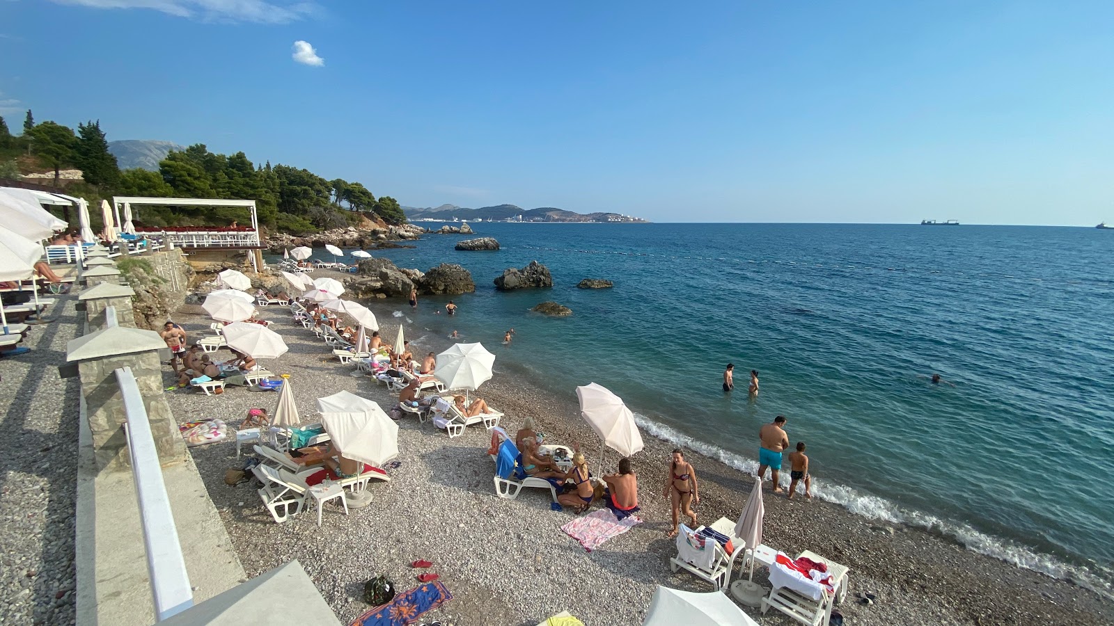 Photo of Wild beach with gray fine pebble surface