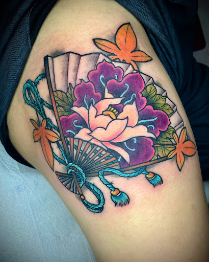 Explore flower and butterfly tattoo ideas, creative tattoo ideas in Lakeview, available at Backwoods Tattoo Studio