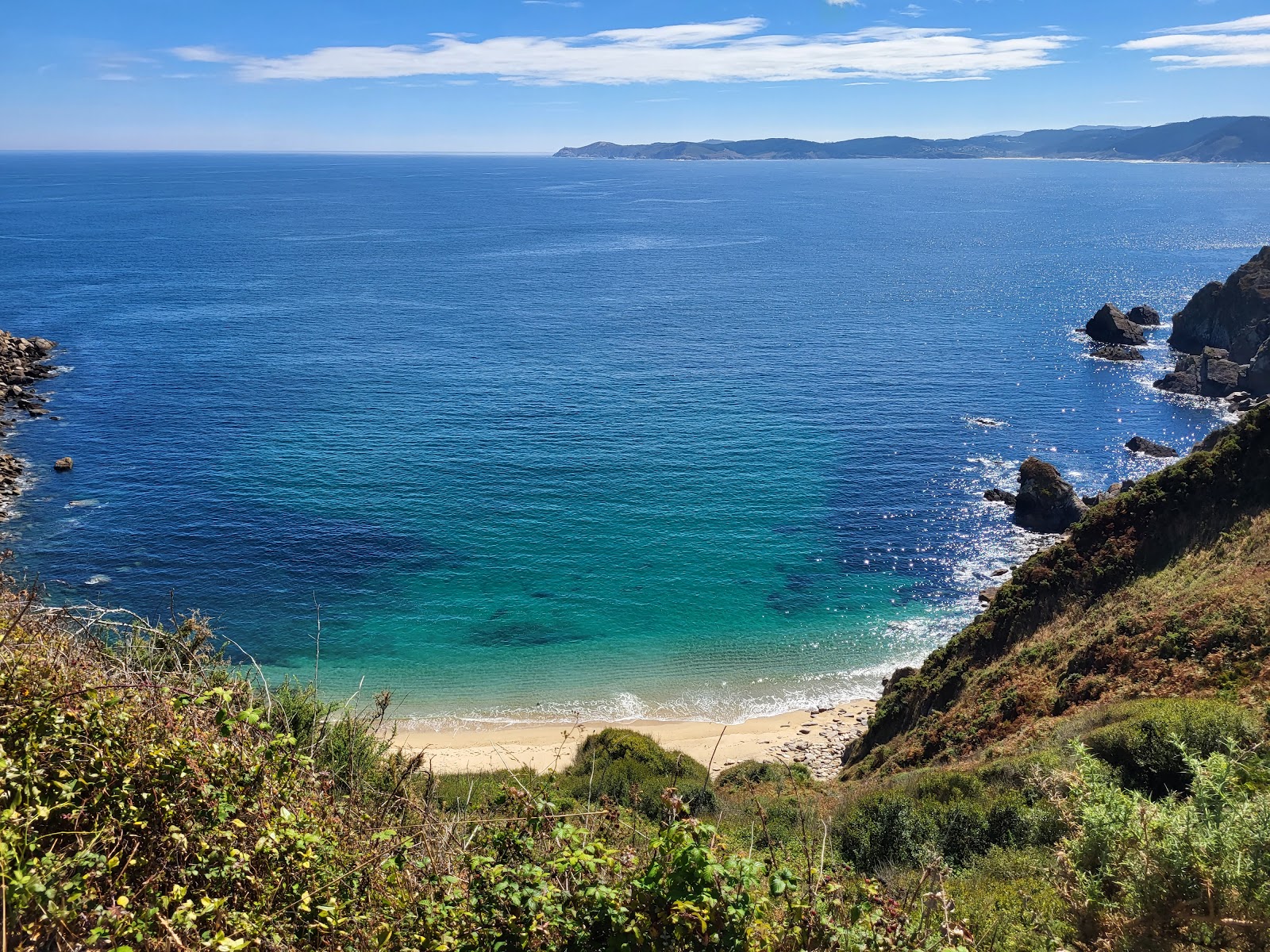 Praia Toxido'in fotoğrafı geniş bir kıyı şeridi ile birlikte