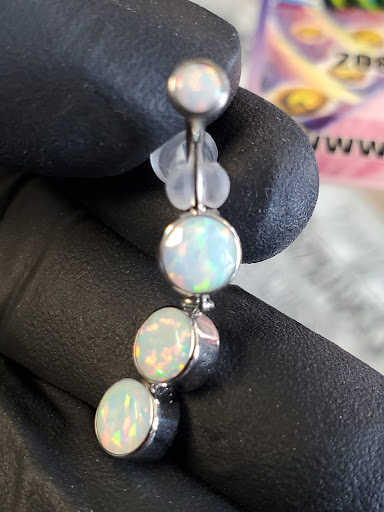 Find boob tattoo ideas for females for your next unique tattoo in Aurora at Skin of A Different Color