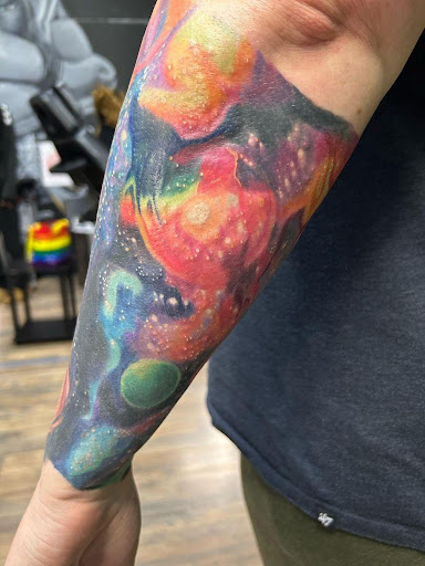 Explore dog tattoo ideas for guys, creative tattoo ideas in Milwaukee, available at Beauty is Pain Tattoo and Body Piercings